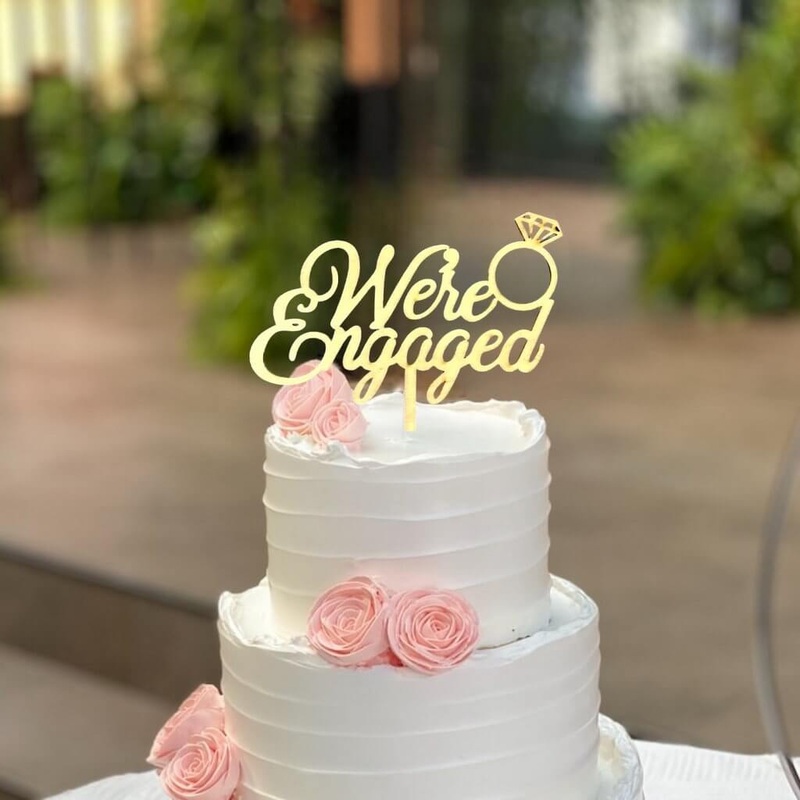 Gold Acrylic 'We're Engaged' Diamond Ring Cake Topper