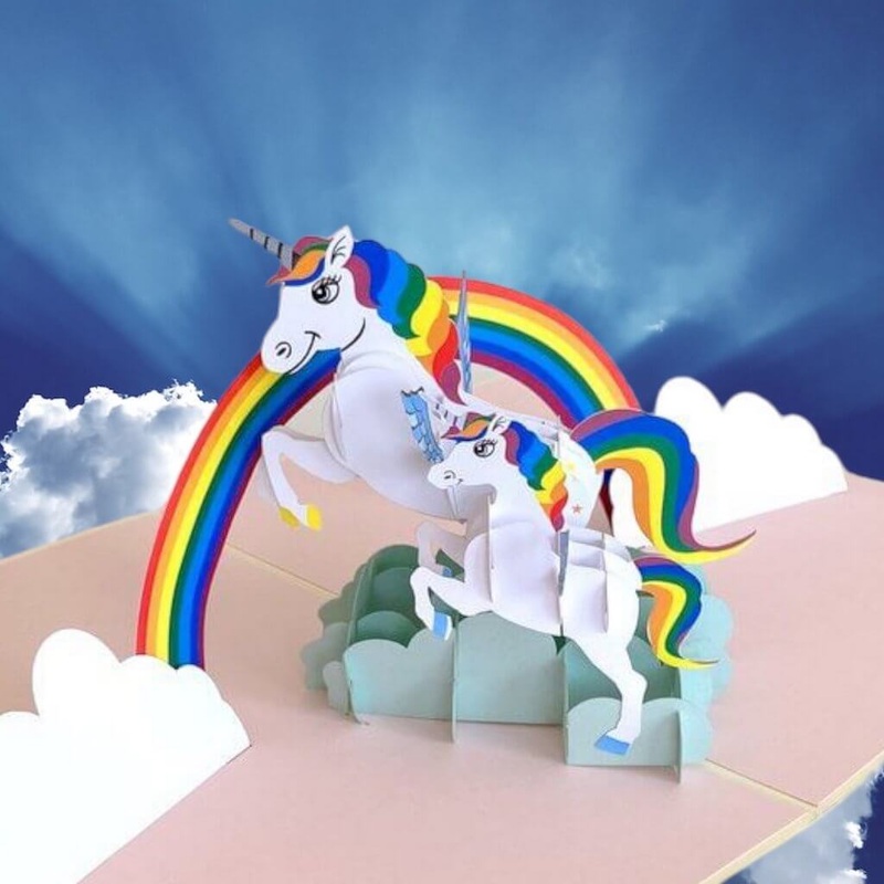 White Unicorn Mum and Baby Jumping Over Rainbow Card